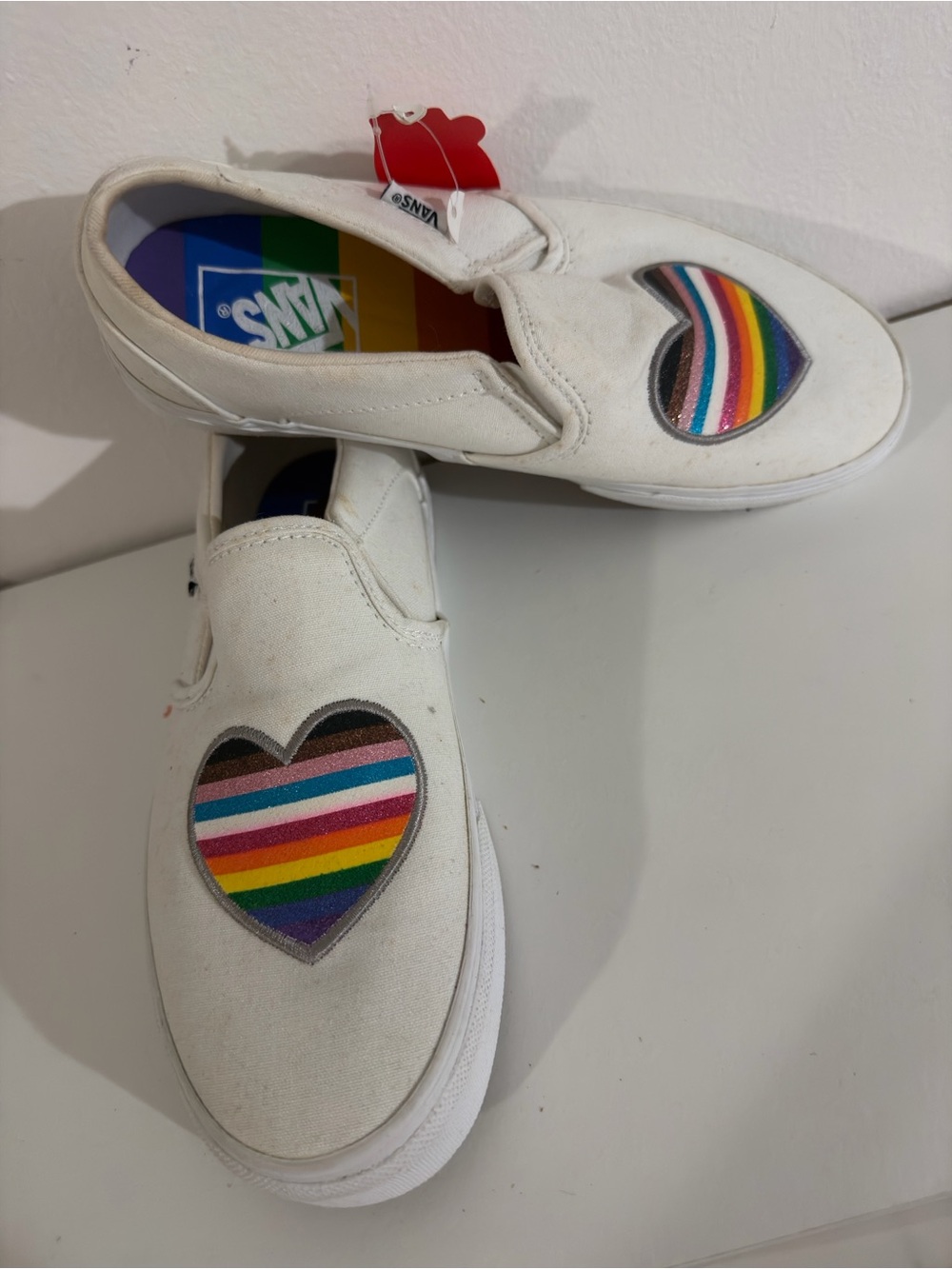 Vans Kids White Slip-On Sneakers with Rainbow Heart Patch